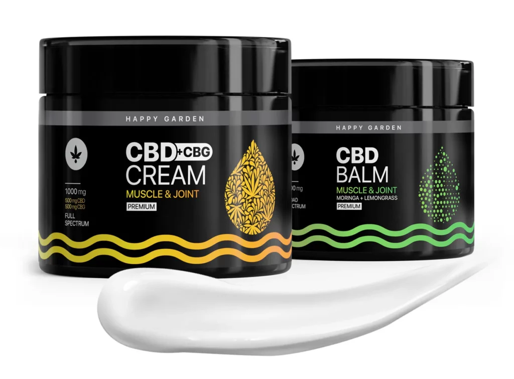 A Happy Garden CBD-termékek két fekete tégelye - az egyik CBD+CBG Cream Muscle & Joint, a másik CBD Balm feliratú - fehér krémmel elöl látható, amely tökéletes azok számára, akik a CBD olajvásárlás izom- és ízületi enyhülést fontolgatják.